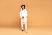 Fashionable afro man in tracksuit.