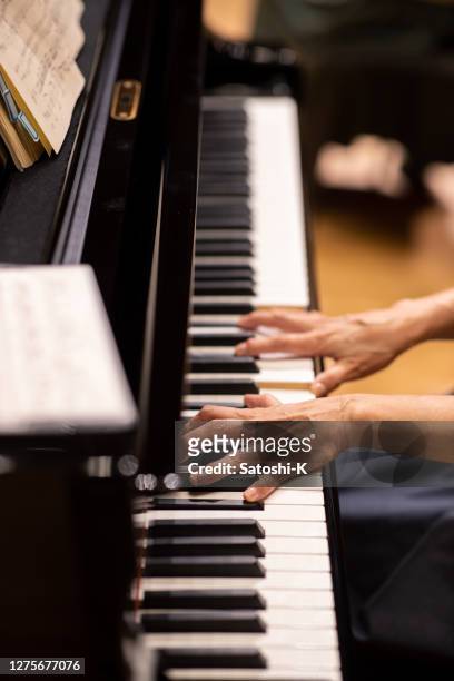 close up of pianist playing the piano at concert - concert pianist stock pictures, royalty-free photos & images