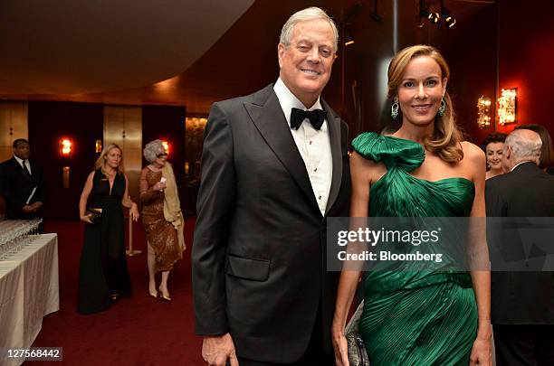 David H. Koch, executive vice president at Koch Industries Inc., left, poses for a photo with Julia Koch during the opening night at the Metropolitan...