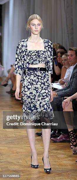 Model walks the runway during the Nina Ricci Ready to Wear Spring / Summer 2012 show during Paris Fashion Week on September 29, 2011 in Paris, France.