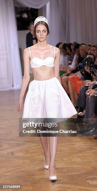 Model walks the runway during the Nina Ricci Ready to Wear Spring / Summer 2012 show during Paris Fashion Week on September 29, 2011 in Paris, France.