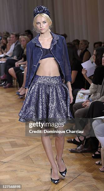 Model walks the runway during the Nina Ricci Ready to Wear Spring / Summer 2012 show during Paris Fashion Week on September 29, 2011 in Paris, France.