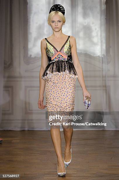 Model walks the runway at the Nina Ricci Spring Summer 2012 fashion show during Paris Fashion Week on September 29, 2011 in Paris, France.