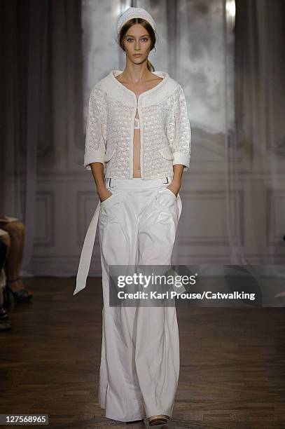 Model walks the runway at the Nina Ricci Spring Summer 2012 fashion show during Paris Fashion Week on September 29, 2011 in Paris, France.