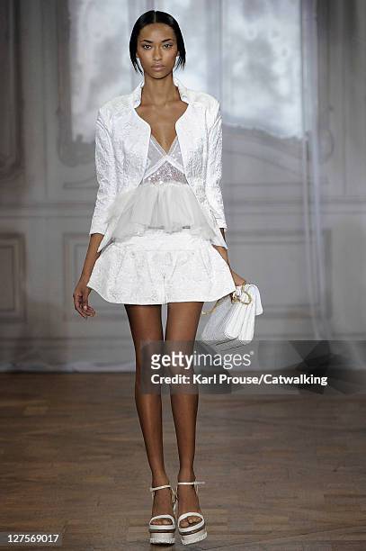 Model walks the runway at the Nina Ricci Spring Summer 2012 fashion show during Paris Fashion Week on September 29, 2011 in Paris, France.