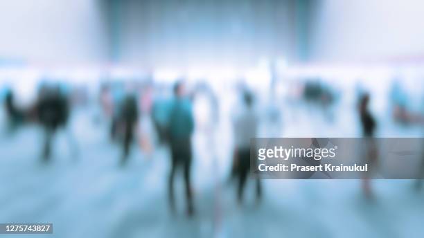 blurred background of trade fairs in the big hall - tradeshow stock pictures, royalty-free photos & images
