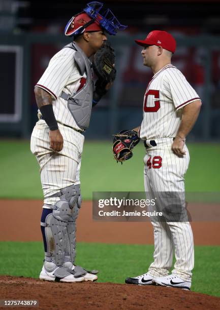 Salvador Perez of the Kansas City Royals talks to pitcher Chance Adams during the 8th inning of the game against the St. Louis Cardinals at Kauffman...
