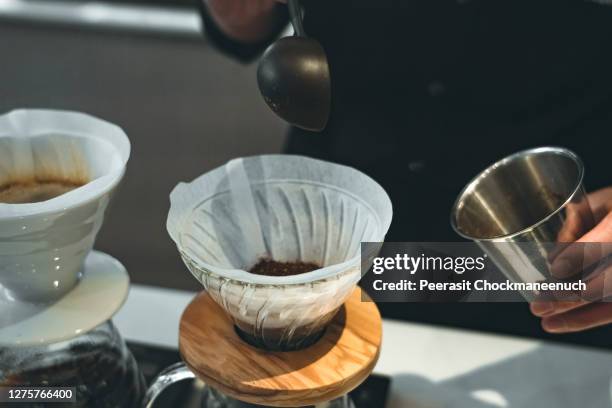 barista dripping and pouring coffee - coffee drip ストックフォトと画像