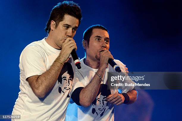 Singers Rogerio Flausino and Dinho performs on stage during a concert in the Rock in Rio Festival on September 29, 2011 in Rio de Janeiro, Brazil....