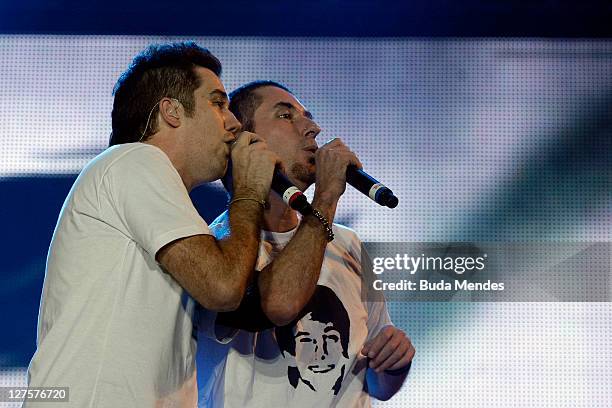 Singers Rogerio Flausino and Dinho performs on stage during a concert in the Rock in Rio Festival on September 29, 2011 in Rio de Janeiro, Brazil....