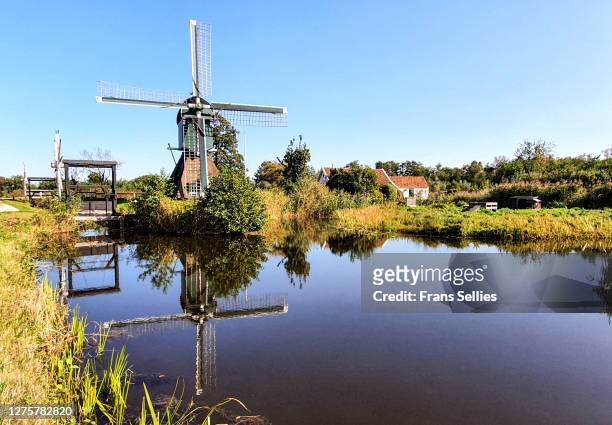 old windmill in the village of tienhoven, netherlands - utrecht stockfoto's en -beelden