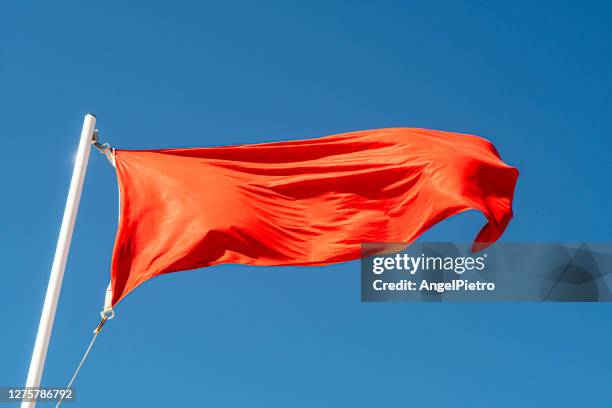 red flag - icon of danger - red flag warning stock pictures, royalty-free photos & images