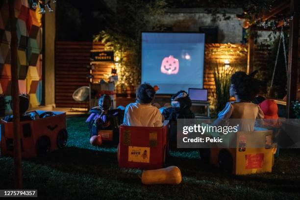 backyard movie night - halloween kid stock pictures, royalty-free photos & images