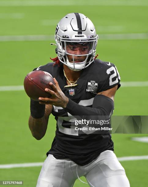 Cornerback Damon Arnette of the Las Vegas Raiders warms up before the NFL game against the New Orleans Saints at Allegiant Stadium on September 21,...