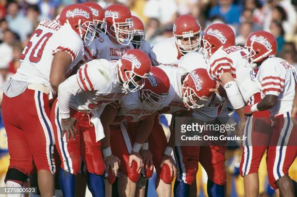 Mark Barsotti, Quarterback for the Fresno State Bulldogs instructs his offensive line in the huddle during the NCAA Western Athletic Conference...