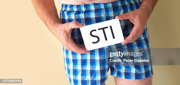 man with sti - genital herpes stock pictures, royalty-free photos & images