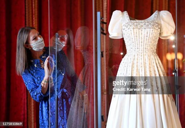 Royal Collection Trust Curator Caroline de Guitut views HRH Princess Beatrice of York's wedding dress on display at Windsor Castle on September 23,...