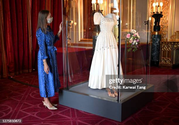 Royal Collection Trust Curator Caroline de Guitut views HRH Princess Beatrice of York's wedding dress on display at Windsor Castle on September 23,...