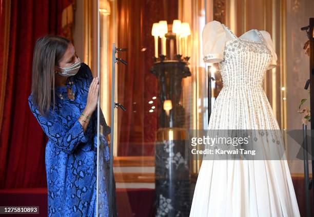 Royal Collection Trust Curator Caroline de Guitut views HRH Princess Beatrice of York's wedding dress on display at Windsor Castle on September 23,...