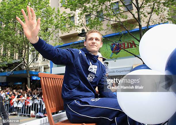 Joel Selwood of the Cats waves to the fans during the AFL Grand Final parade on September 30, 2011 in Melbourne, Australia.