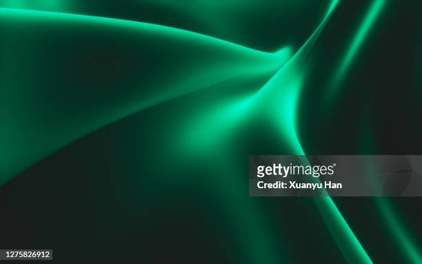 abstract green wave on black background - flowing silk stock-fotos und bilder