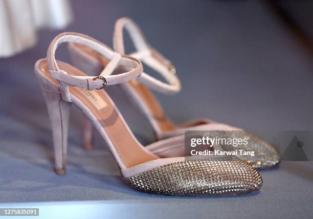 Princess Beatrice of York's wedding shoes and wedding dress on display at Windsor Castle on September 23, 2020 in Windsor, England. Princess Beatrice...