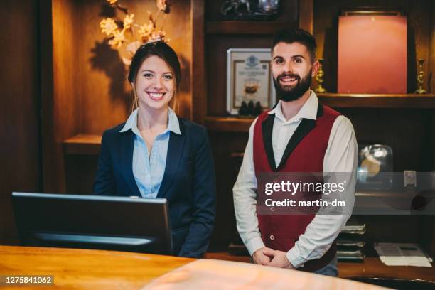 smiling hotel staff - bellhop stock pictures, royalty-free photos & images