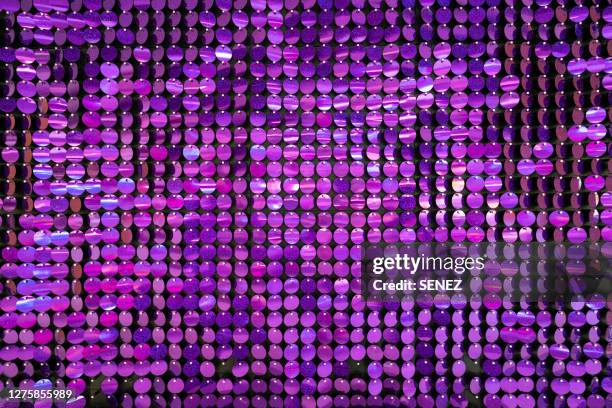 full frame shot of vibrant glittering sequins - purple texture foto e immagini stock