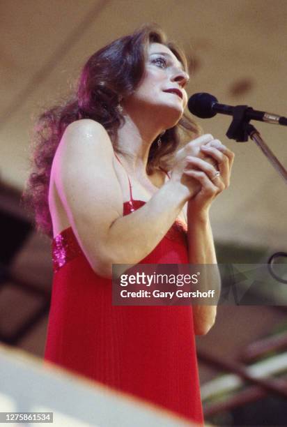 American folk and pop artist Judy Collins performs onstage during the Dr. Pepper Concert Series at Central Park, New York, New York, July 7, 1979.