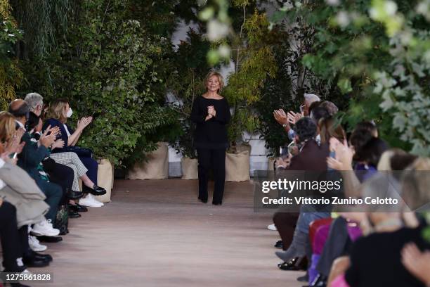 Fashion Designer Alberta Ferretti acknowledges the applause of the audience at the Alberta Ferretti fashion show during the Milan Women's Fashion...