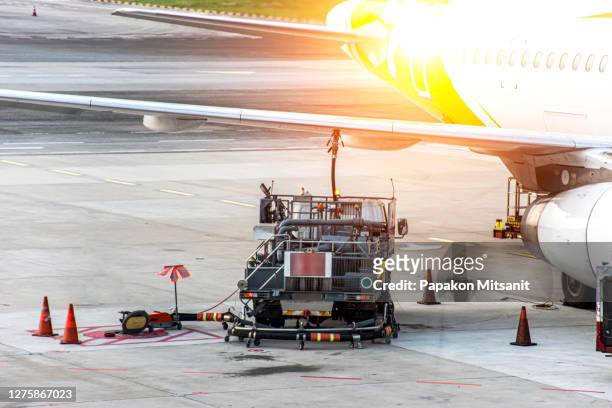 oil truck with suction function and increase the pressure to deliver oil into the wings of the aircraft - air cargo stock pictures, royalty-free photos & images