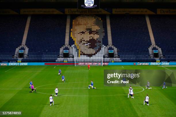 General view inside the stadium as players take a knee in support of the black lives matter movement prior to the Carabao Cup third round match...