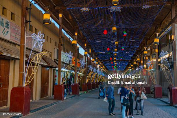 the people strolling in souq al mubarakey discovering reasonable bargains on heritage goods, kuwait city, capital of kuwait - kuwait tradition stock pictures, royalty-free photos & images