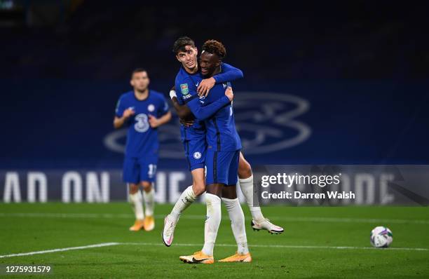 Kai Havertz of Chelsea celebrates after scoring his sides fourth goal with teammate Tammy Abraham during the Carabao Cup third round match between...