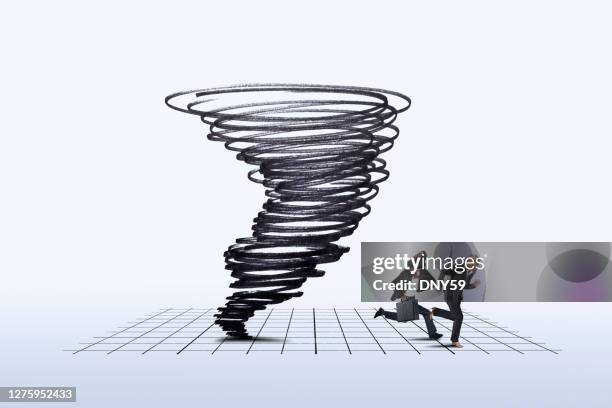 businesswoman and businessman running away from swirling tornado - avoiding danger stock pictures, royalty-free photos & images