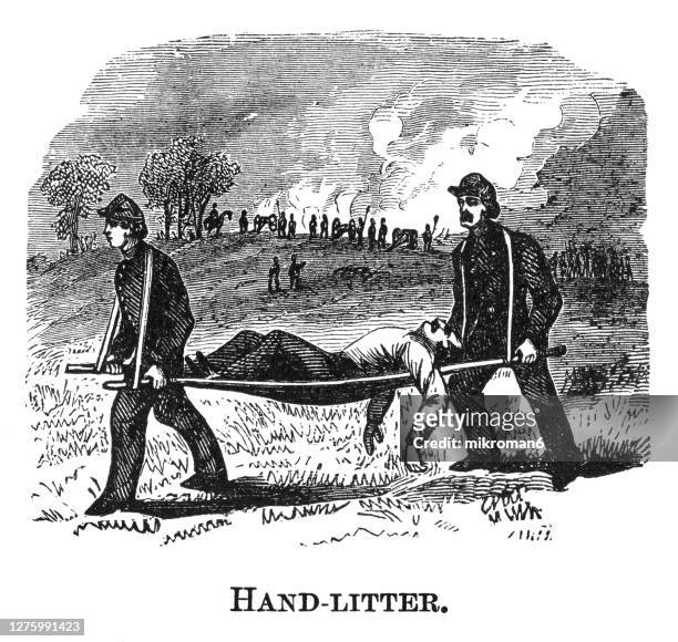 old engraved illustration of injured soldier is carried on a litter by companions - war of independence ireland stock pictures, royalty-free photos & images
