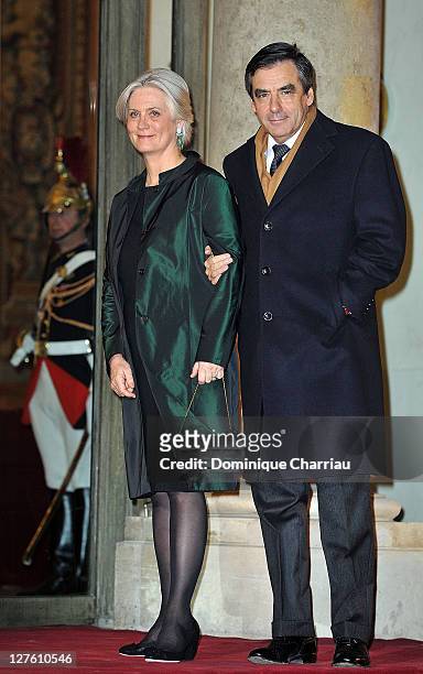 French Prime minister François Fillon and his wife Penelope pose as they arrive to the State Dinner At Elysee Palace Honouring South African...