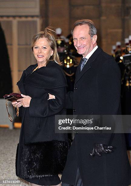 French minister of Defense Gerard Longuet and his wife pose as they arrive to the State Dinner At Elysee Palace Honouring South African President...