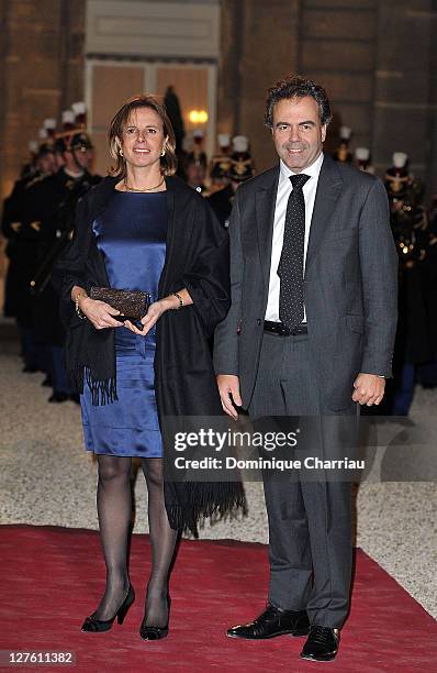 French minister of Education Luc Chatel and his wife Astrid pose as they arrive to the State Dinner At Elysee Palace Honouring South African...