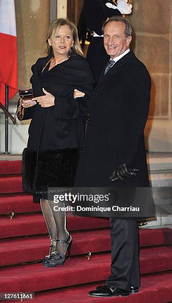 French minister of Defense Gerard Longuet and his wife pose as they arrive to the State Dinner At Elysee Palace Honouring South African President...