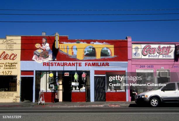 Restaurante Familiar at 4085 East Whittier Boulevard in East Los Angeles, California has an image of a woman making tortillas painted above the door,...