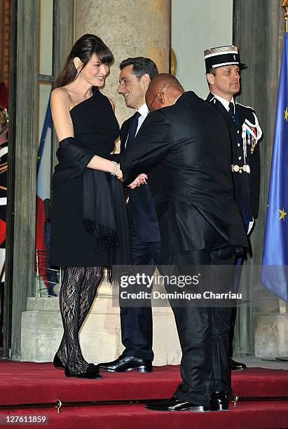 French President Nicolas Sakozy and wife Carla Bruni-Sarkozy South African President Jacob Zuma and wife Gloria Bongi Ngema pose as they arrive to...