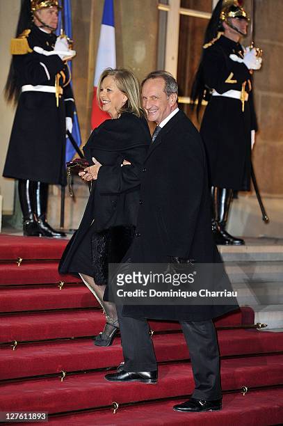 French minister of Defense Gerard Longuet and his wife pose as they arrive to the State Dinner At Elysee Palace Honouring South African President...