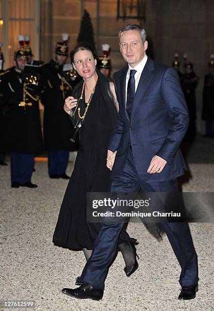 France's Minister for Agriculture Bruno Lemaire and wife arrive to attend a state dinner with South African President Jacob Zuma and wife at Elysee...