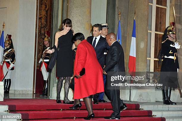 French President Nicolas Sakozy and wife Carla Bruni-Sarkozy South African President Jacob Zuma and wife Gloria Bongi Ngema pose as they arrive to...