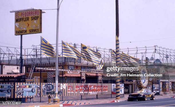 El Pedorrero Muffler Shop at 4101 East Whittier Boulevard in Los Angeles, California has an intensely decorative facade meant to attract passersby,...