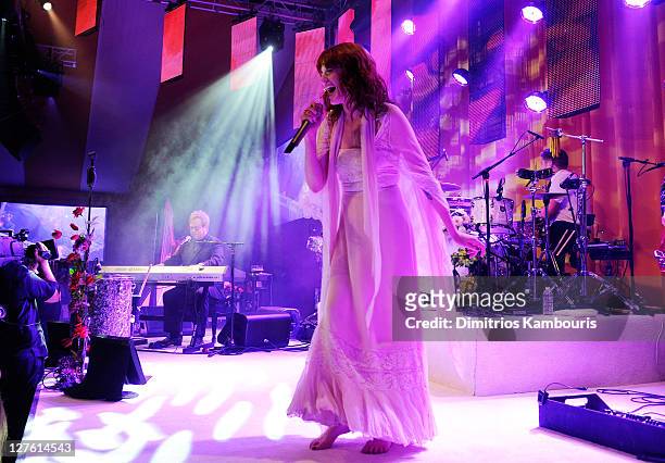 Musician Elton John and singer Florence Welch of Florence and the Machine perform onstage at the 19th Annual Elton John AIDS Foundation Academy...