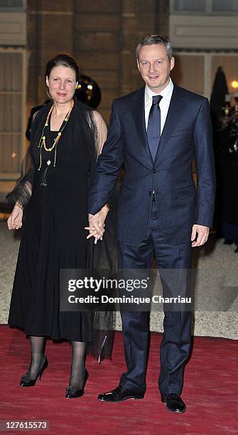 France's Minister for Agriculture Bruno Lemaire and wife arrive to attend a state dinner with South African President Jacob Zuma and wife at Elysee...