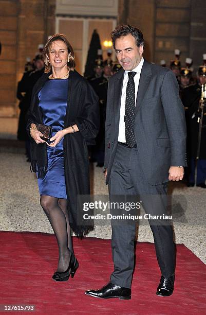 French minister of Education Luc Chatel and his wife Astrid pose as they arrive to the State Dinner At Elysee Palace Honouring South African...