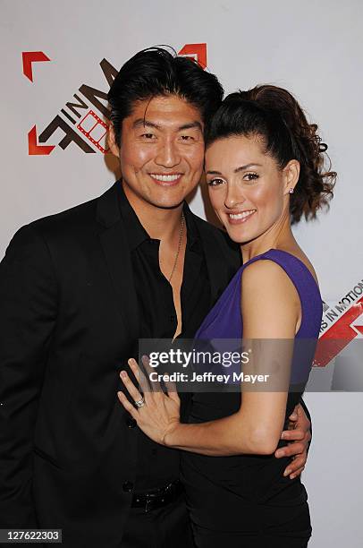 Actors Brian Tee and Mirelly Taylor arrive at the World Premiere of "Blood Out" at Directors Guild Of America on April 25, 2011 in Los Angeles,...